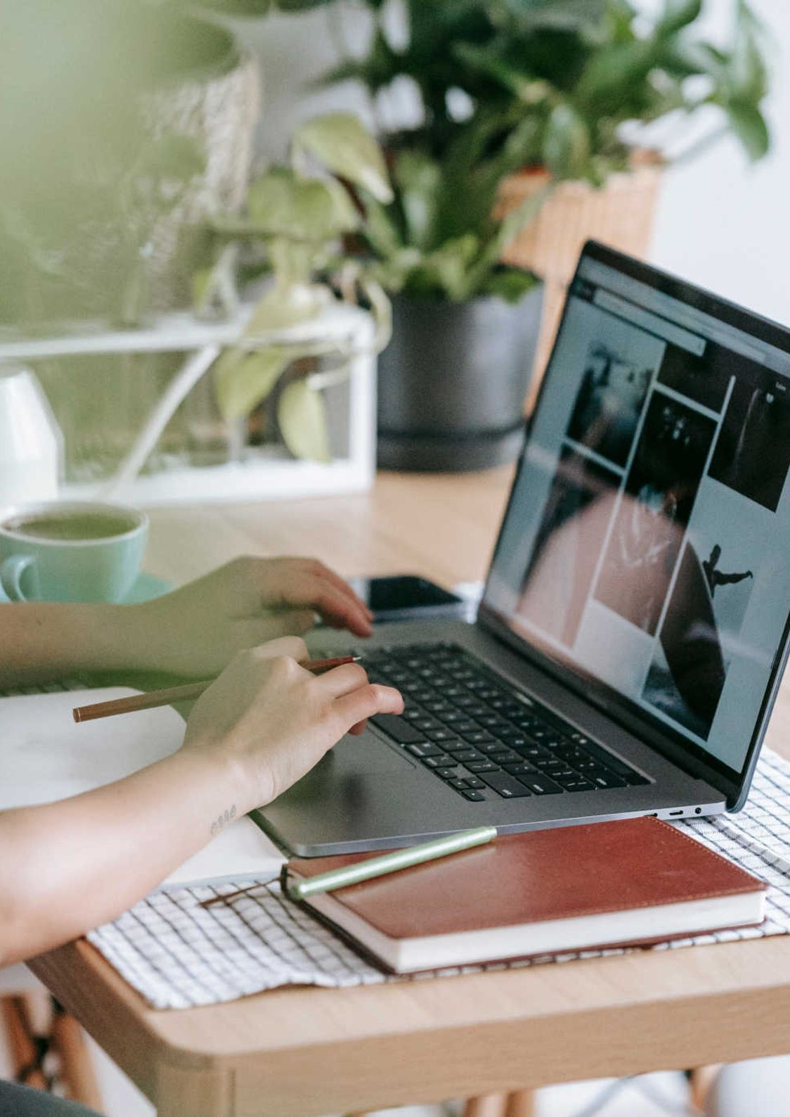 Person typing on a laptop.